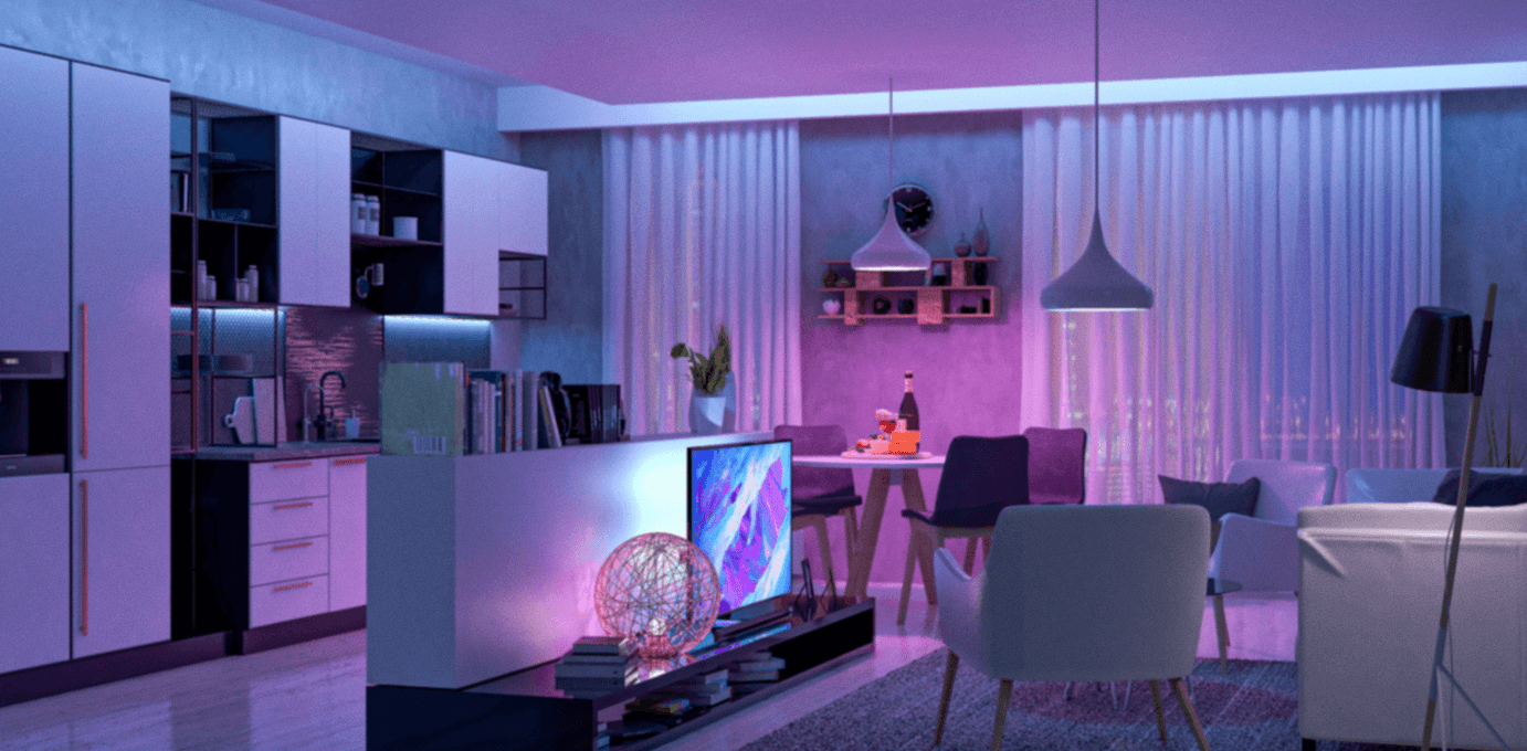 A living room with purple lighting and furniture.